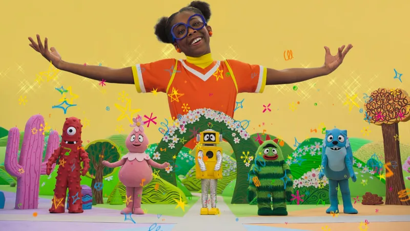 Kammy Kam au centre du décor coloré de Gabbaland avec les personnages en arrière-plan
